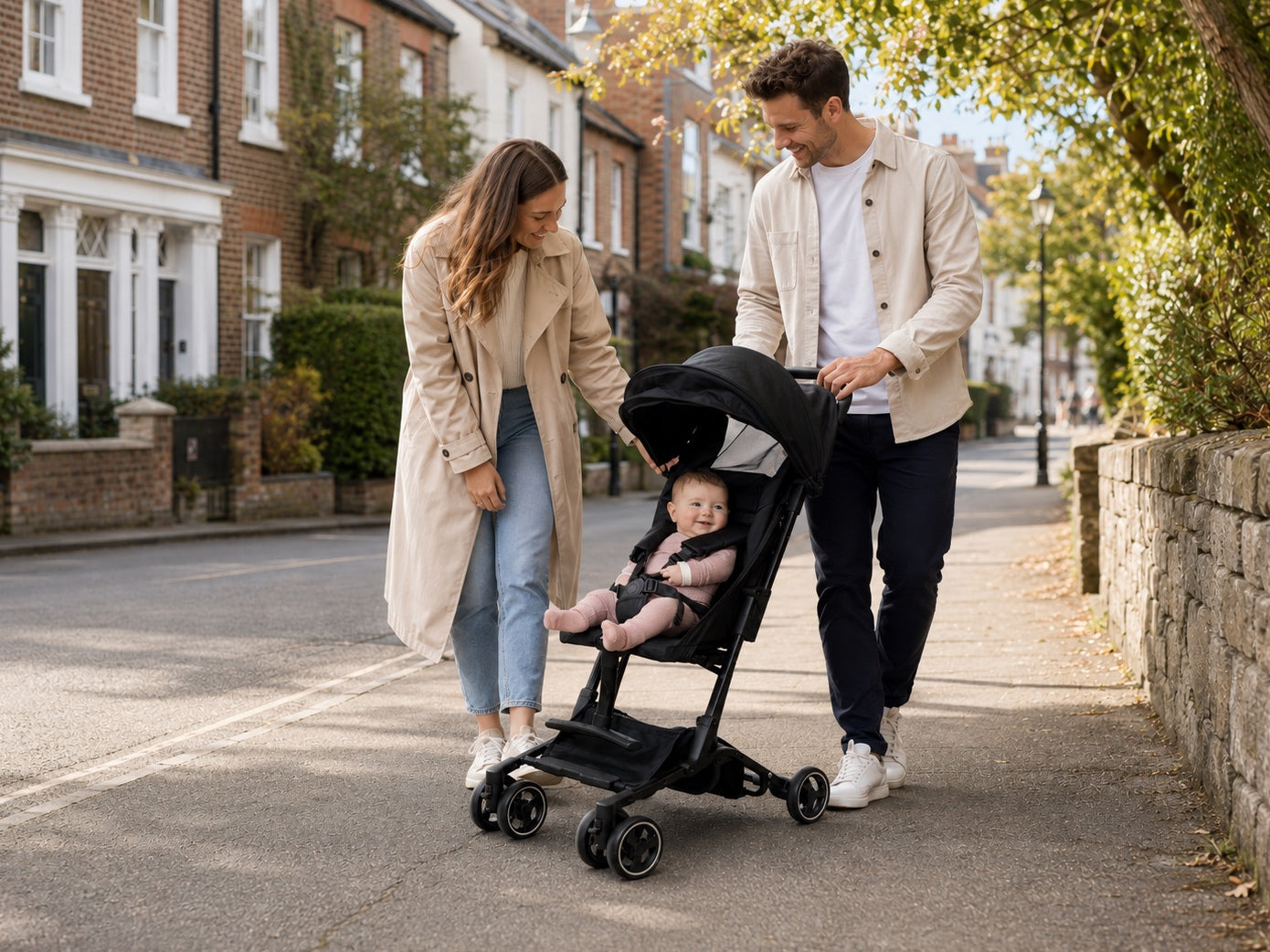 Young family on a relaxed daytime walk with a compact stroller